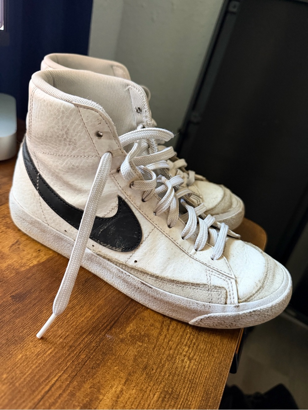 Nike White High-Top Sneakers with Black Swoosh